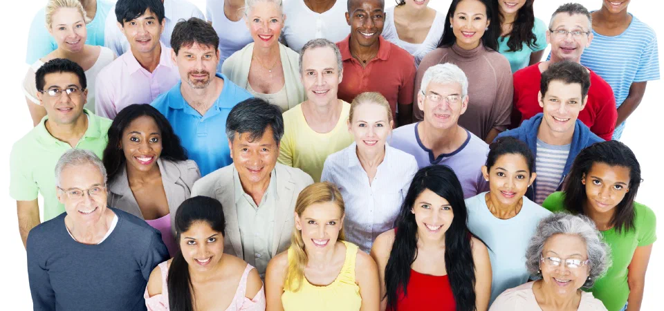 A group of smiling neighbours standing together