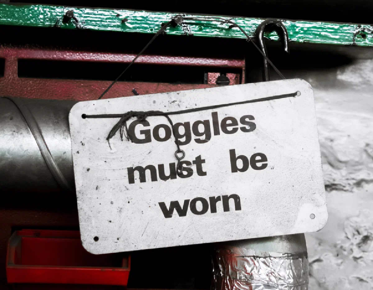 Picture of a sign that reads, "Goggles must be worn."
